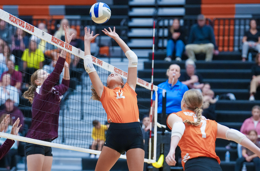 Rockford’s Kendall Anderson (12) sets during a match against Grandville. 