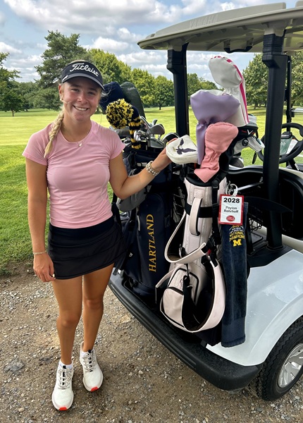 Rohrhoff stands next to her bag for a photo.