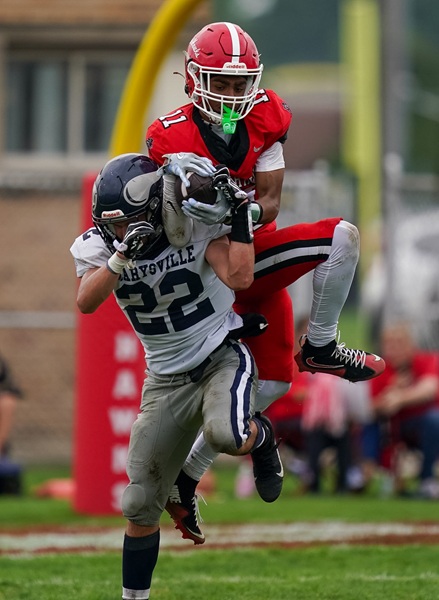 Carter Bankston (11) contends for the ball with a Marysville player.