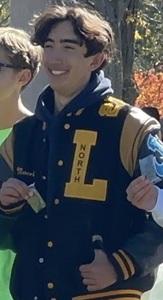 Solgot holds up his medal after this season’s Macomb County championship meet.
