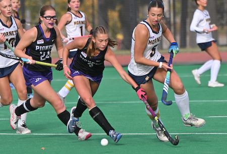 Pioneer's Alexis Heys (3) and Saline's Ella Arvai (5) contend for the ball.