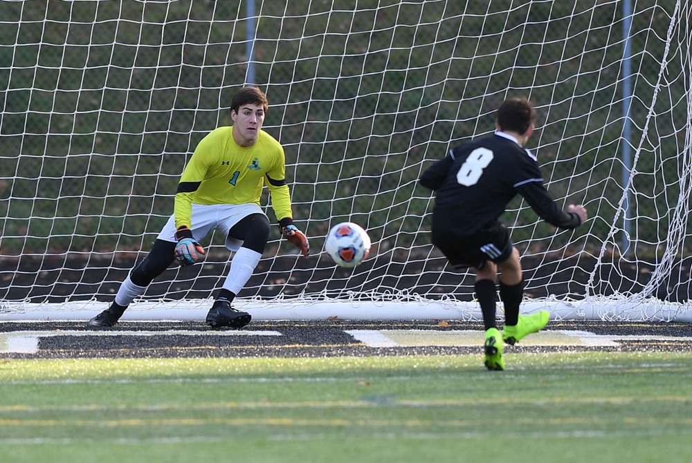 A keeper awaits a soccer penalty kick attempt.